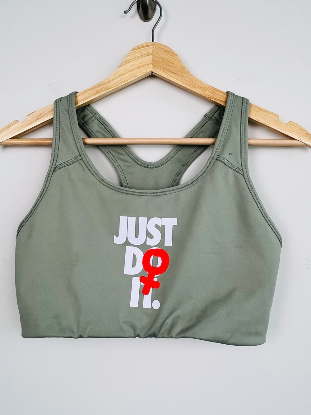 Nike Rebel Swoosh JDI green Venus racerback sports bra, medium.